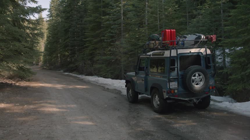 A jeep stopping on the side of the road