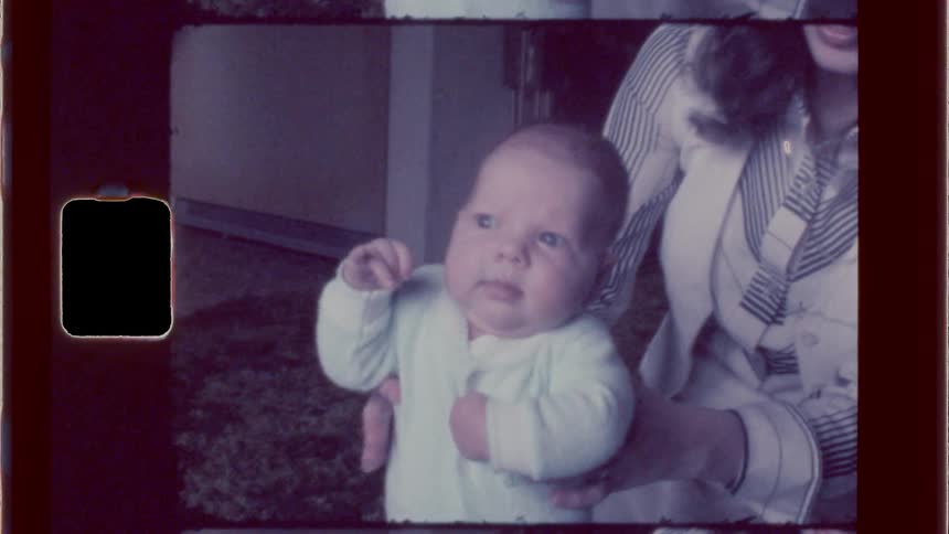 Infant lifted by a lady