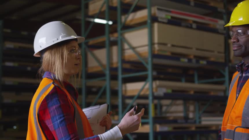 Two workers talking to each other