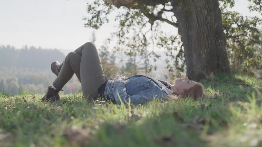Girl lying in a meadow