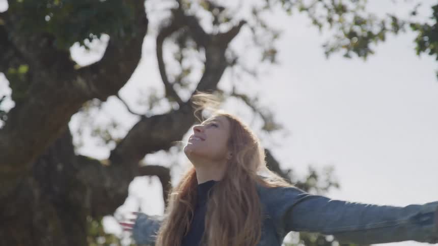 Girl running around happy and immersed in nature