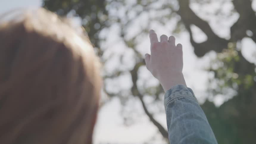 Girl with her hand up