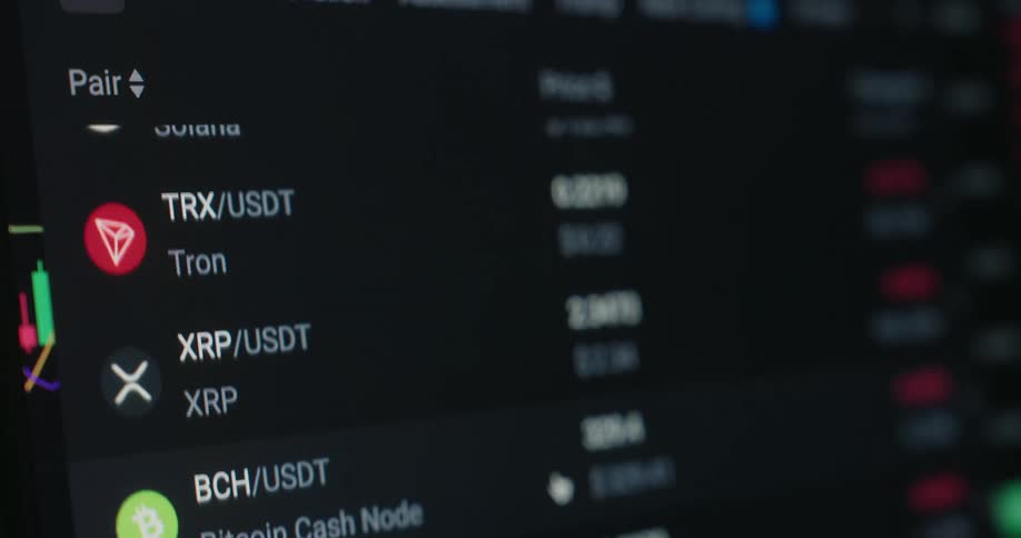 A list of cryptocurrencies are scrolling on the screen