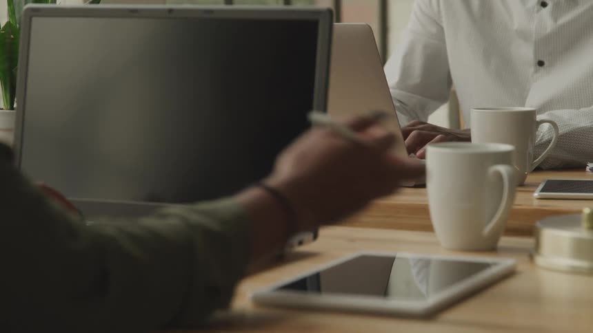 People are working at their desks on computers
