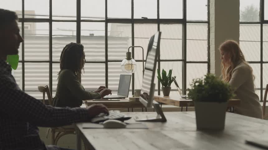 A footage of people working on a computer in the office