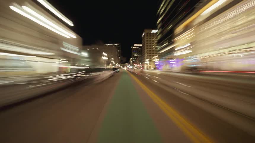 Moving backward on the road in a city at night