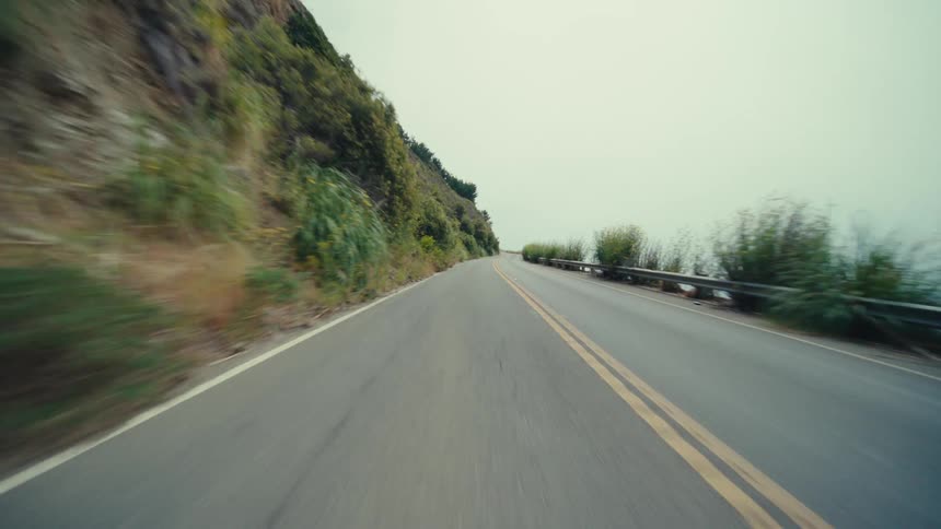 Traveling on a mountainside road along the coast