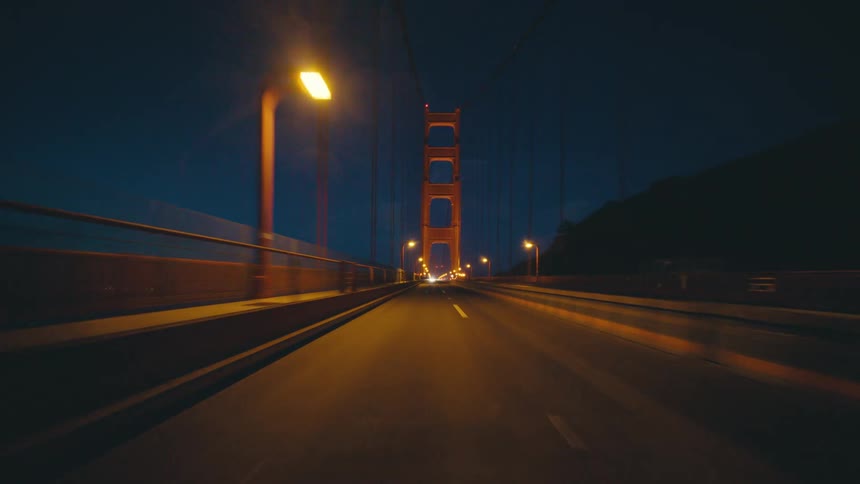 The roads on the bridge are dark at night