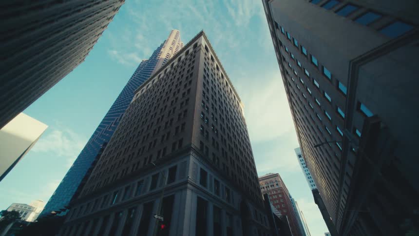 Tall buildings fill the city on a bright day