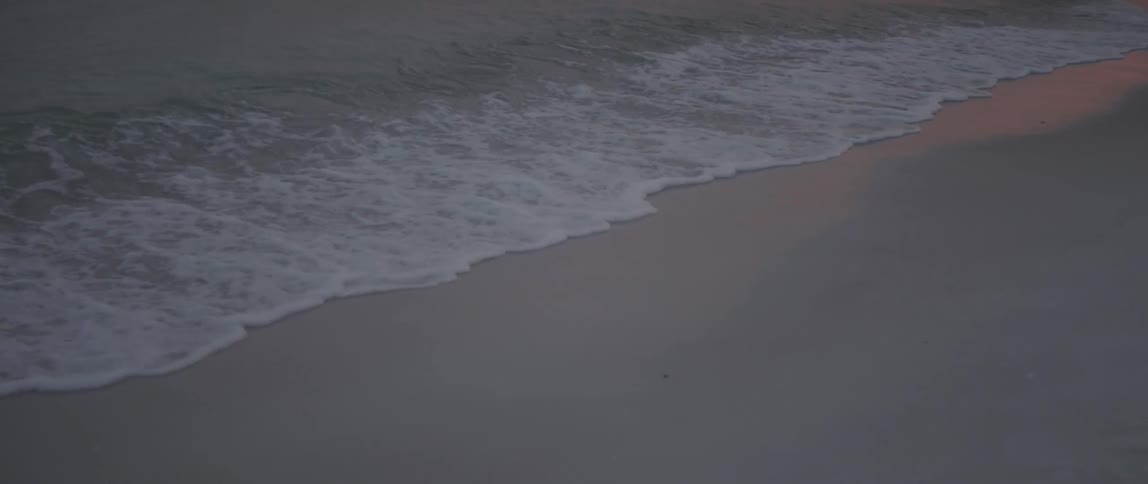 Small waves crash on the beach