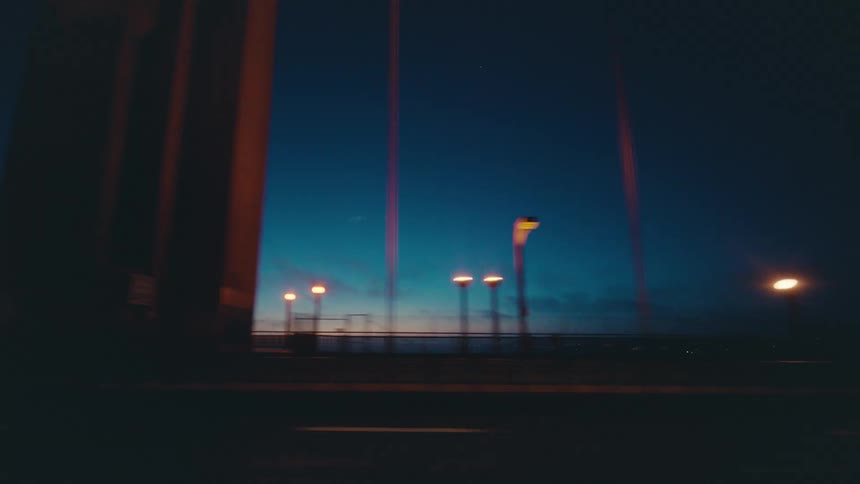 Cars pass by on the bridge