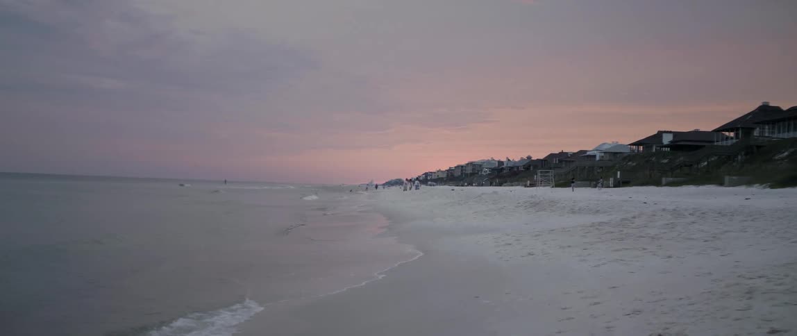 Ocean beach line at sunset
