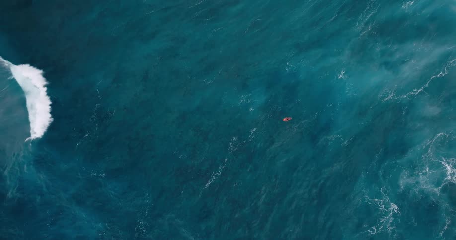 Person kayaking alone in the middle of the ocean