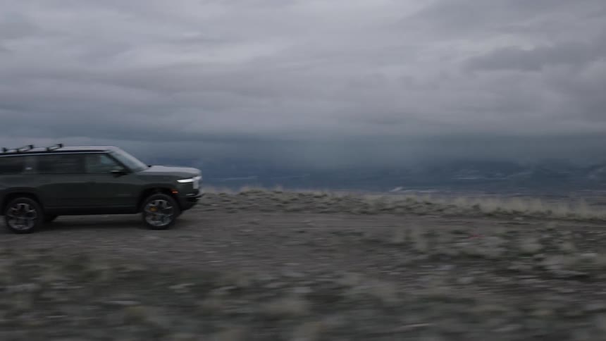 The vehicle is driving off road on the mountain