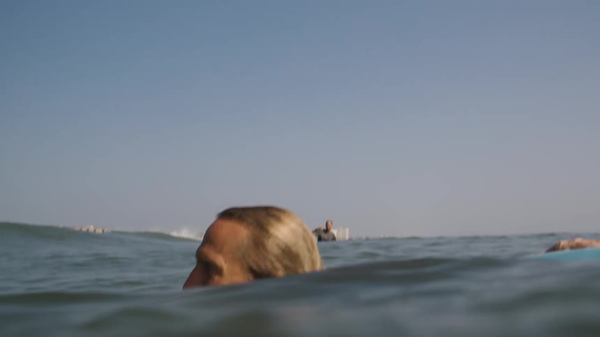 A man is floating in the water