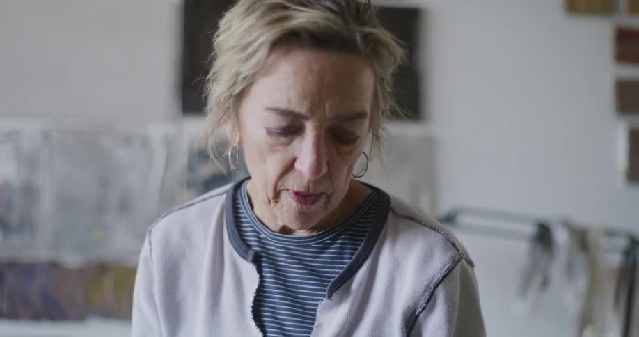 A footage of an elderly woman in a room