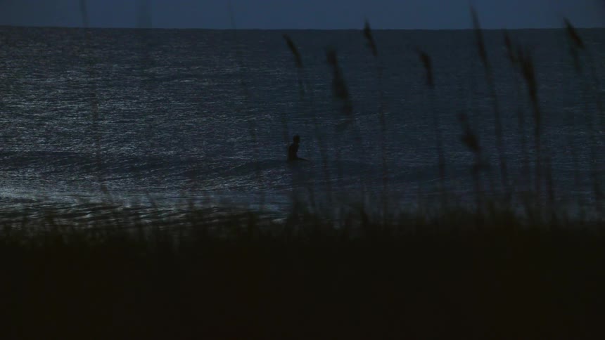 Man at sea in the evening