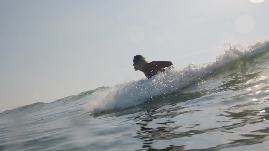 Boy surfing in the waves