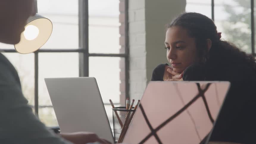 People type and work in the office together