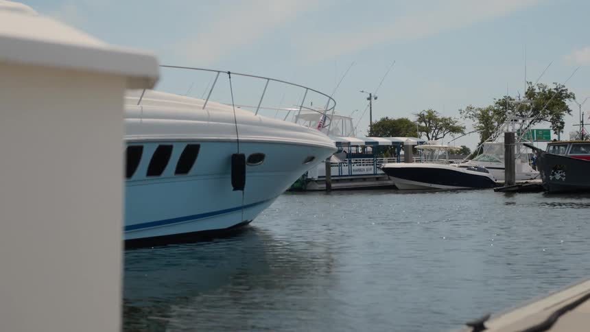 Yachts and boats are docked in the harbor