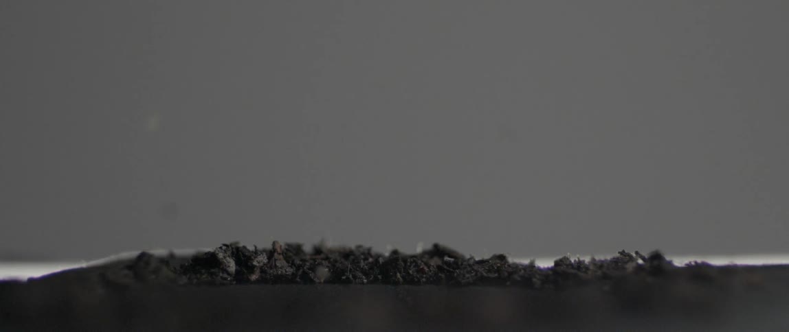 Vibrating makes these pieces of dirt jump around