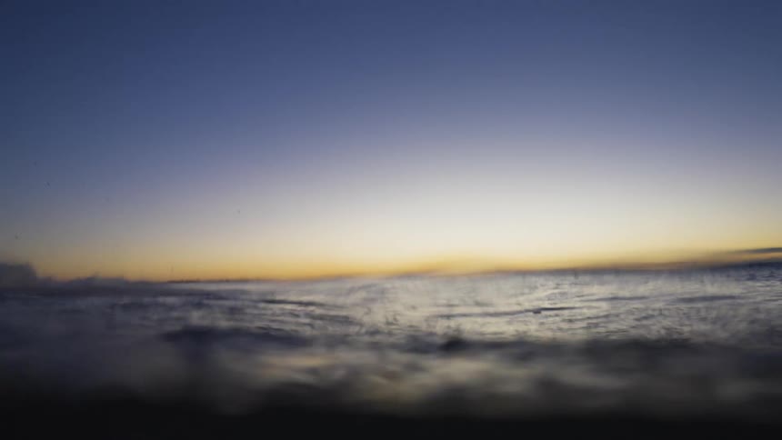 A small wave breaks in the evening