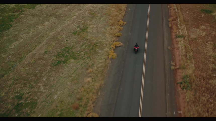 Motorcycle crossing a mountain road