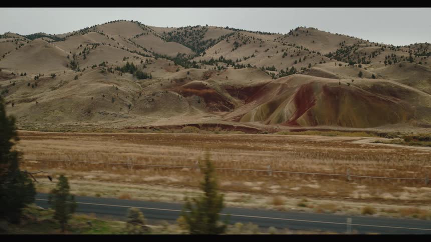 A mountain range is next to the road