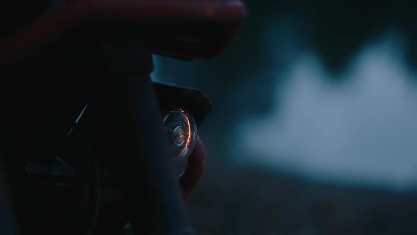 The motorcycle is parked outside