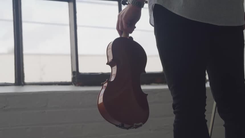 Person holding a violin