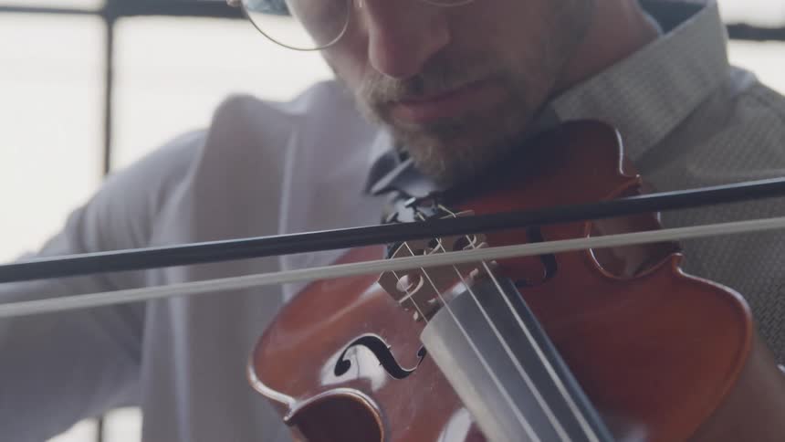 A man playing a violin