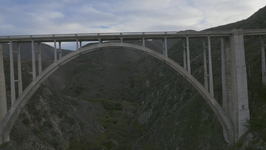 A large bridge gaps a mountain top
