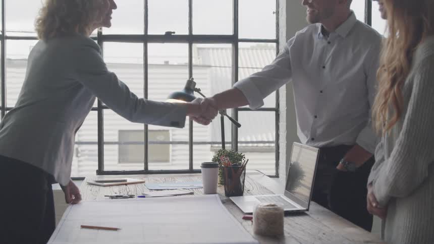 A footage of people exchanging pleasantries in the office
