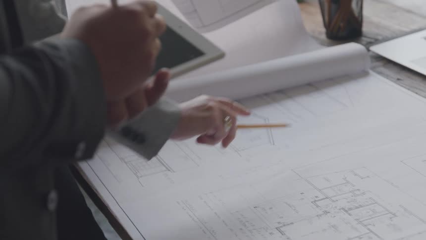 Architect studying a floor plan