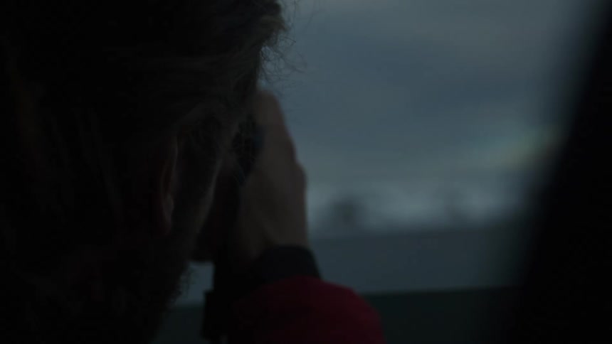 A man is photographing the water