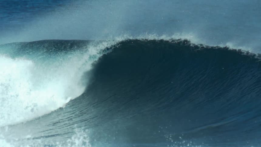 The wave rolls and crashes