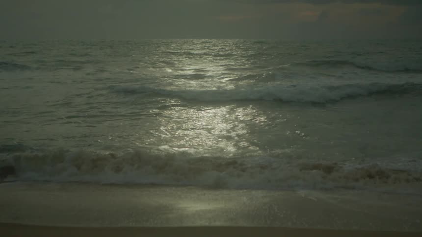 Moonlight shining off ocean waves