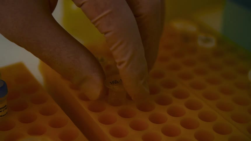A footage of a person holding a medical chemical tube