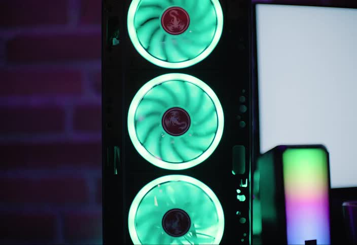 Fans with neon lights are spinning on the computer