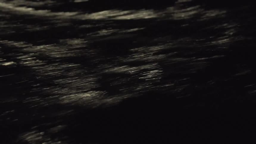 A river moves fast at night