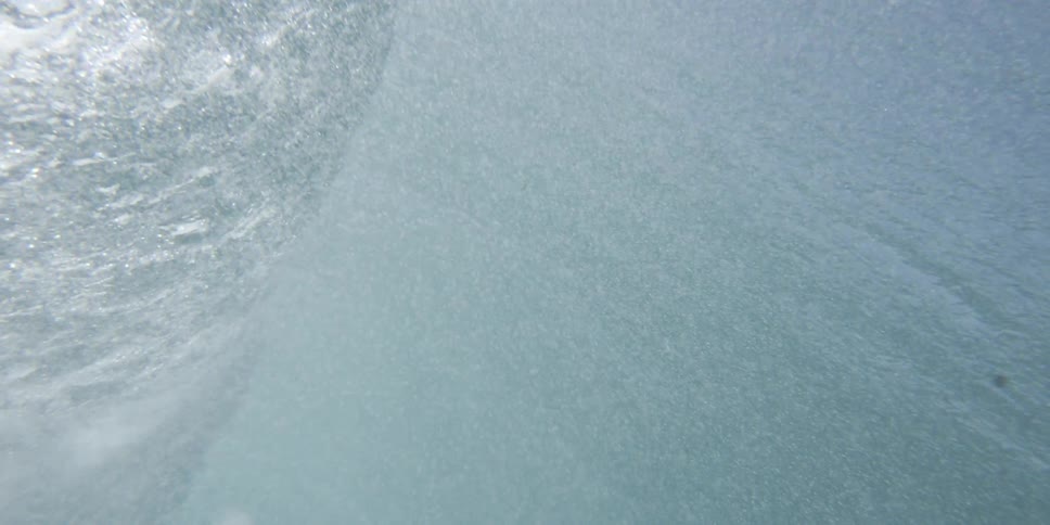 Bubbles flow up after the wave hits