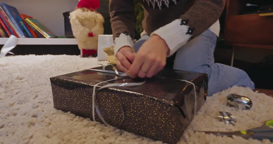 A footage of a person boxing a gift