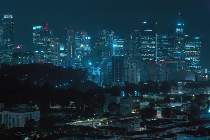 A timelapse captures a tower complex being constructed in the city giving the impression it was completed within a single day