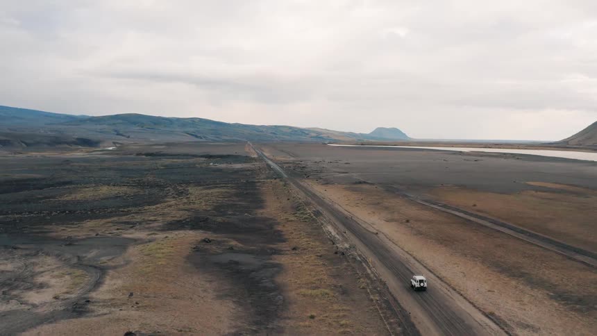 A footage of a car moving in the desert