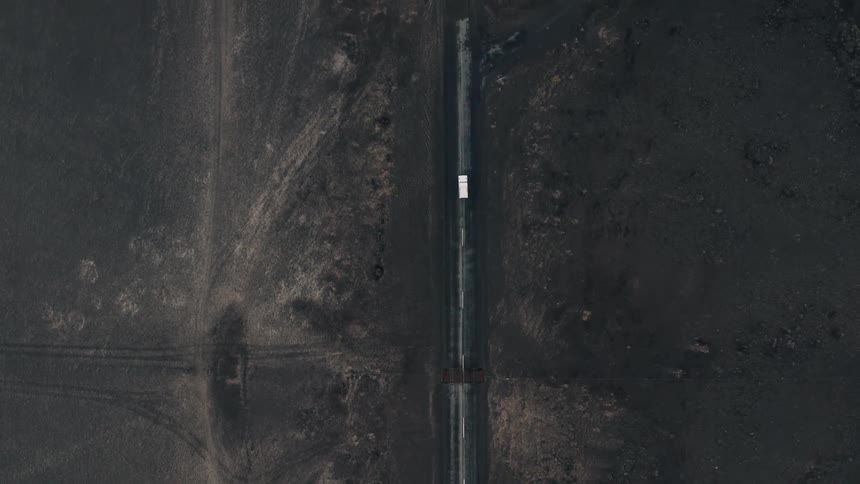 Vehicle travels along a highway through the rural countryside