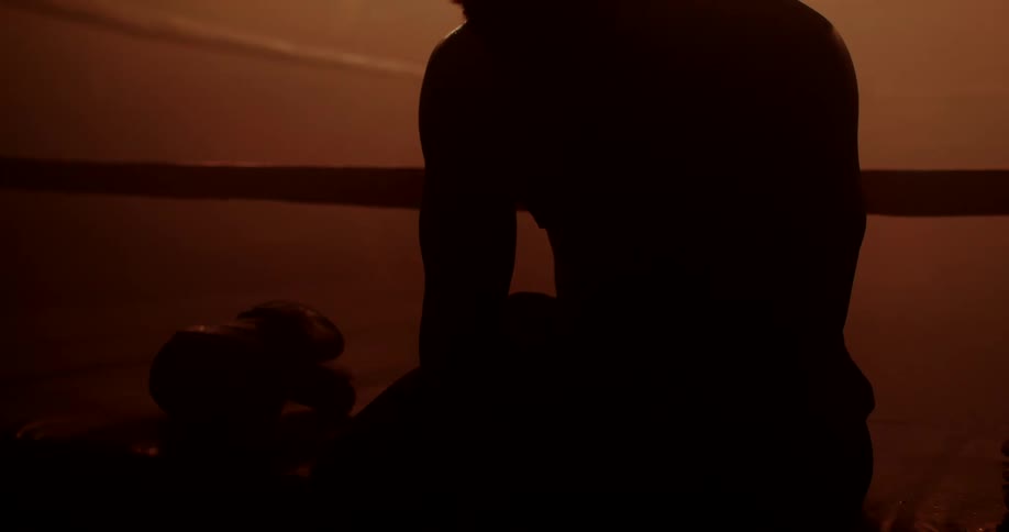 A footage of a boxer sitting in the ring