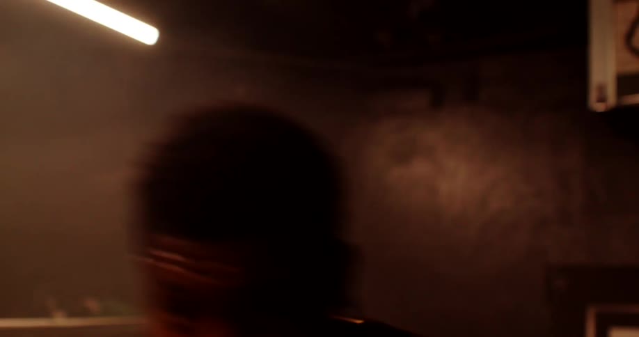 A man is shadowboxing in the ring