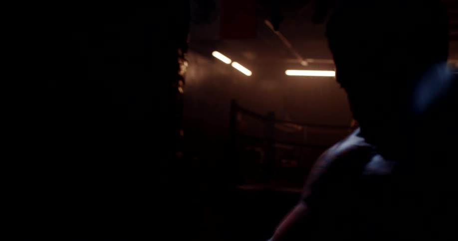 A boxer practicing on a punching bag