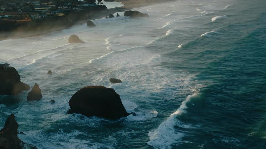 A mist hovers over the shore