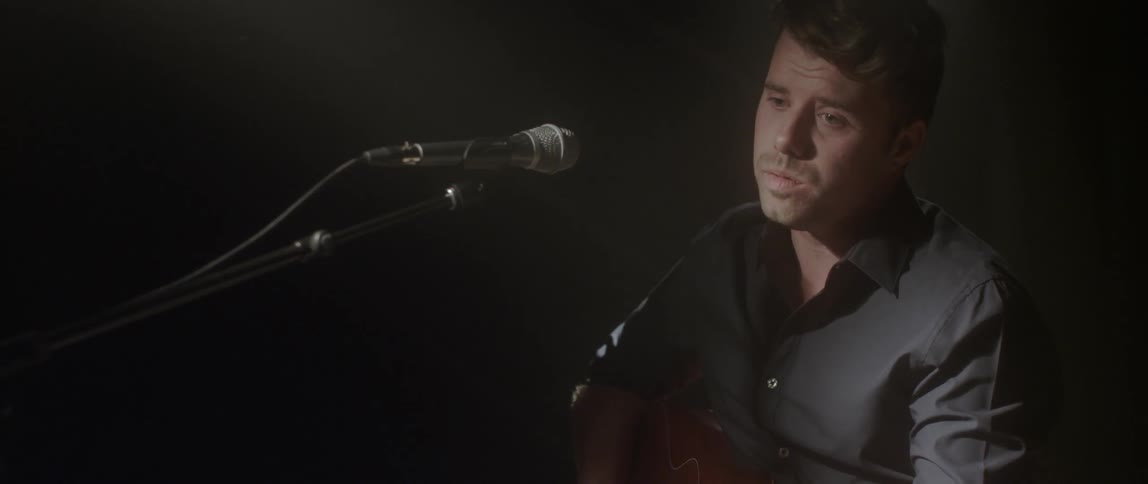 A man is singing into a microphone